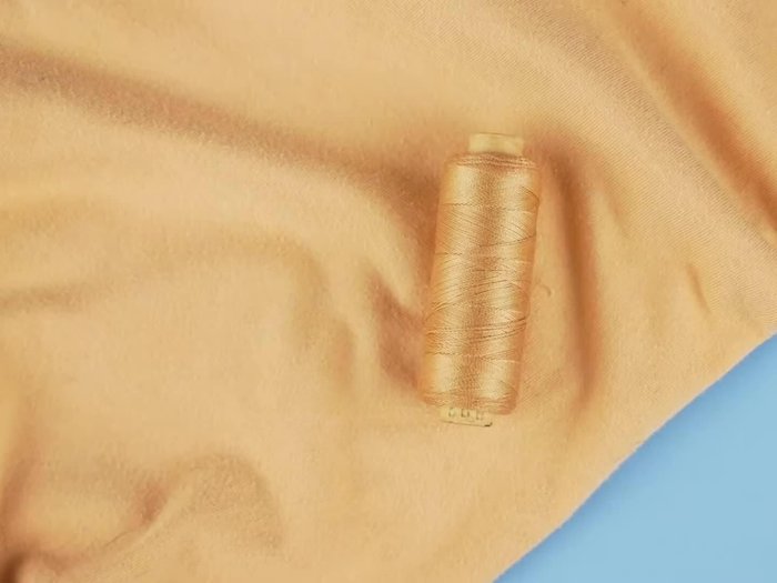 Turn the fabric inside out.