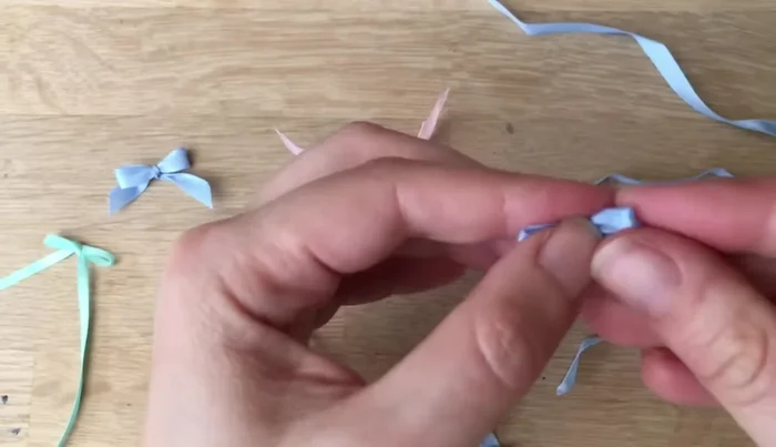 Once the knot is tight, trim the ends of the ribbon.