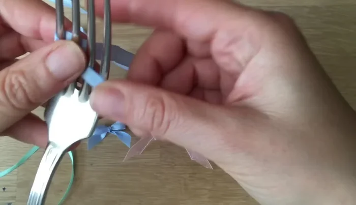 Prepare your ribbon. Make sure the bottom piece is longer than the top.