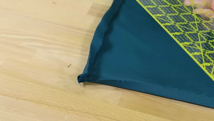 Mitered Corners: Create folded mitered corners for a neat finish. Unfold the corner, draw a diagonal line, cut, and fold to create the mitered look.