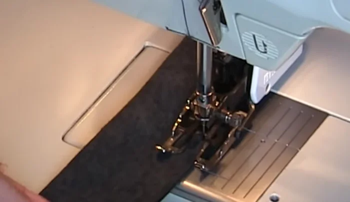 Sew lengthwise: Fold each strip lengthwise with right sides together, using a 1/4 inch seam allowance. Cut a 45° angle on the tie ends. Trim seam allowances.