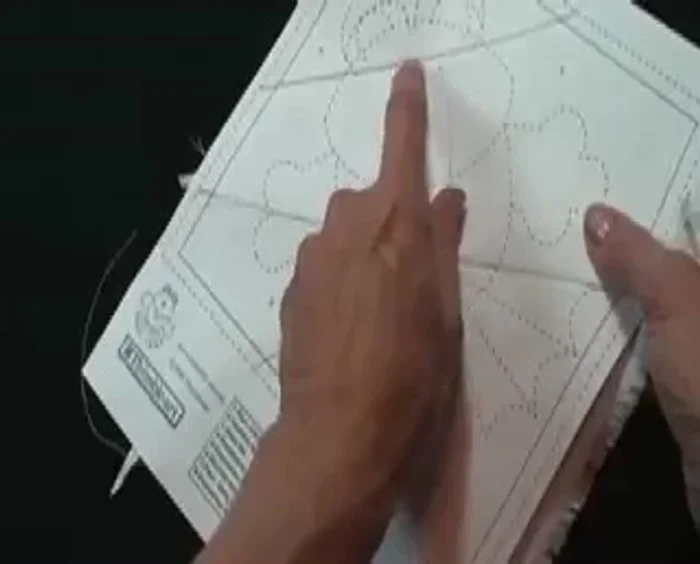 Sew all the way around, turn it over, and hand close the opening. Place the hands behind the lining; put the hands under and blind stitch around the outside, reinforcing the corners.