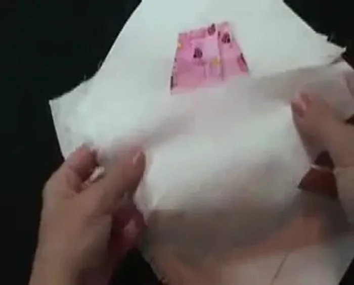 Sew all the way around, turn it over, and hand close the opening. Place the hands behind the lining; put the hands under and blind stitch around the outside, reinforcing the corners.