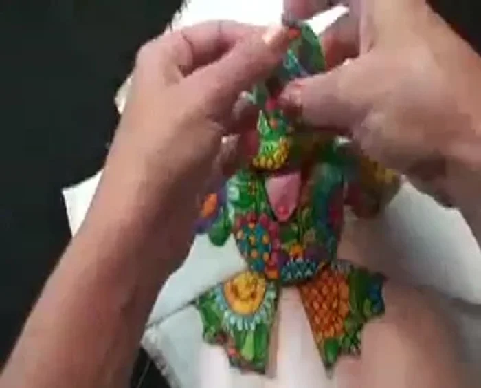 Position the head over the mouth and place the raw edges of the two eyes underneath the head, ensuring the eyelids are on top. Sew from corner to corner, reinforcing edges.