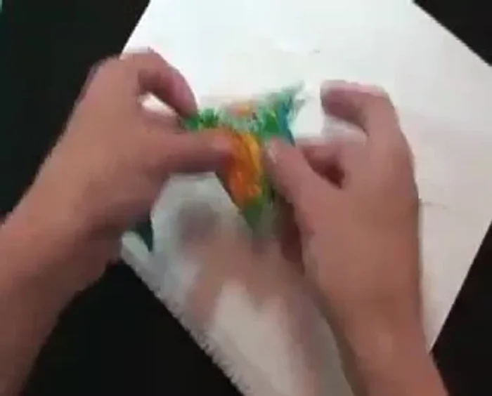 Add fabric pieces number two and three, enclosing the raw edges of the frog's feet.