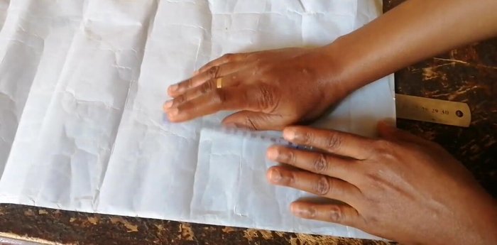 Cut the leather pieces according to the measurements: approximately 23cm length and 6.5cm width for the white leather; 11cm length and 9.5cm width for the brown leather. (Adjustments based on desired size).