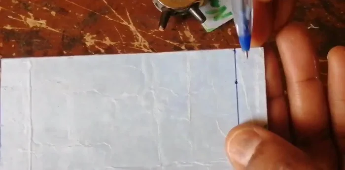 Open the punched holes using a utility knife, carefully following the marked lines.