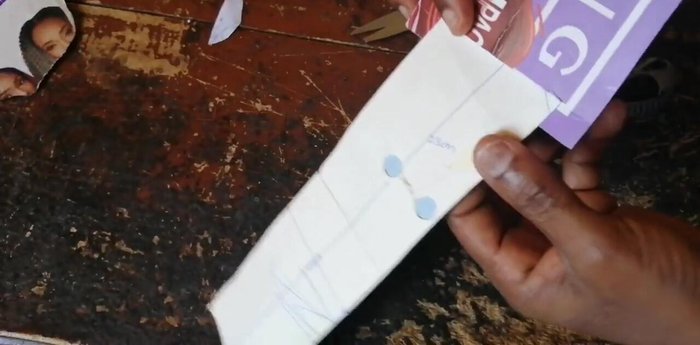 Insert the white leather into the opening from underneath, ensuring a snug fit. Adjust the position if needed for a proper fit.